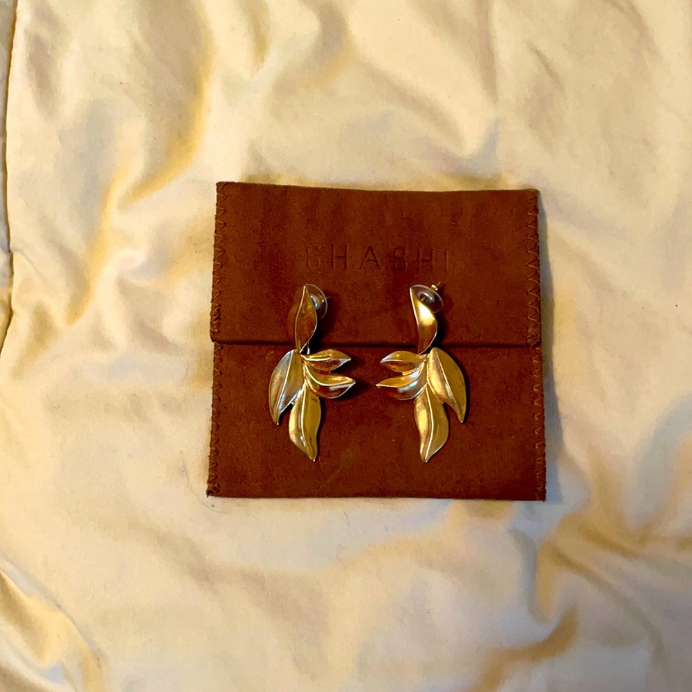 Shashi golden Nina earrings with post and leather pouch